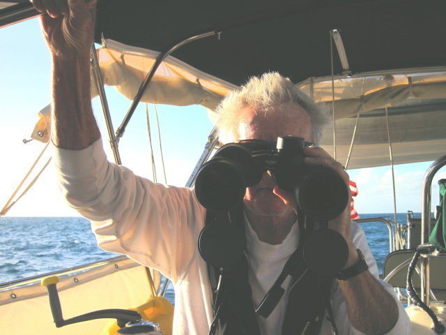 Bob keeps the “Big Eyes” handy: By the end of the voyage, Bob was understandably eager to get home to his Beautifully Betty so kept the binocs at the ready to see Antigua when she came into view late on 1/1.